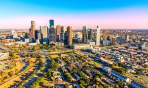 Aerial view of downtown Houston, where ALTA surveys are essential for verifying property lines and legal details in commercial real estate development.