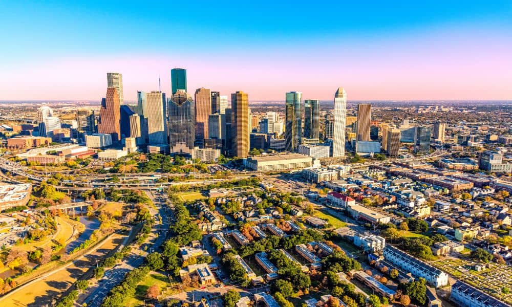 Aerial view of downtown Houston, where ALTA surveys are essential for verifying property lines and legal details in commercial real estate development.