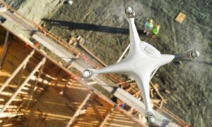 Drone survey flying over a Houston construction site capturing aerial data for fast and accurate land surveying.