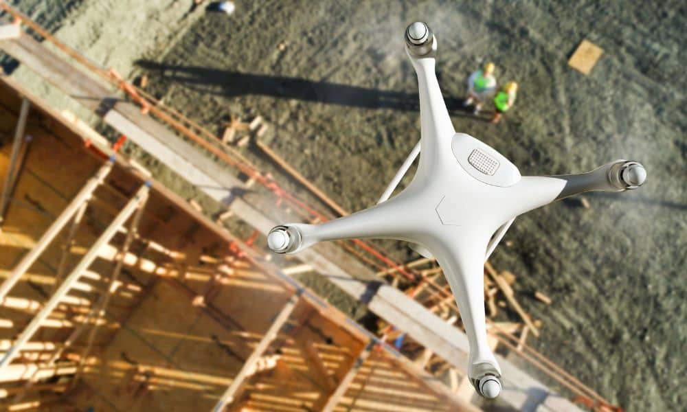 Drone survey flying over a Houston construction site capturing aerial data for fast and accurate land surveying.
