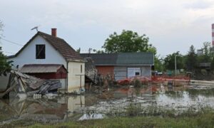 Flooded residential property after heavy rain where a boundary survey may be needed to check for soil movement and shifted property lines