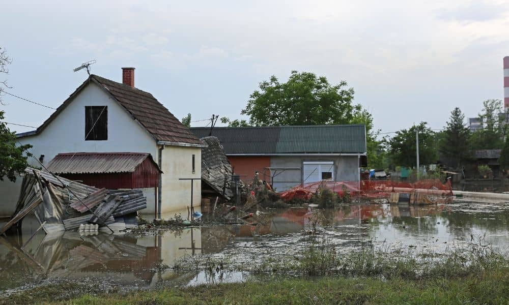 Flooded residential property after heavy rain where a boundary survey may be needed to check for soil movement and shifted property lines