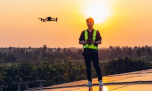 A professional survey pilot conducts a drone survey during sunset, illustrating how crews stay precise when GNSS signals are unstable