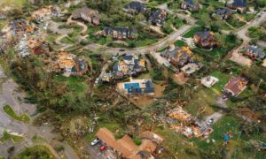Aerial view of tornado debris scattered across a neighborhood, captured in a way that shows details helpful for lidar mapping assessments